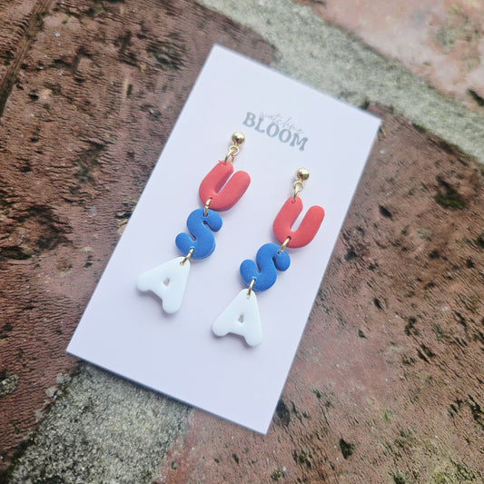 Clay USA dangle earrings on studs