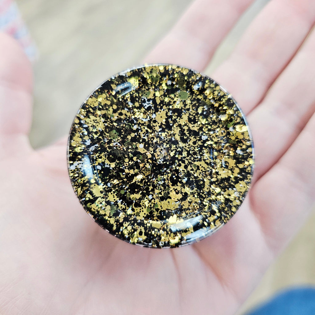 Black and gold face and body glitter