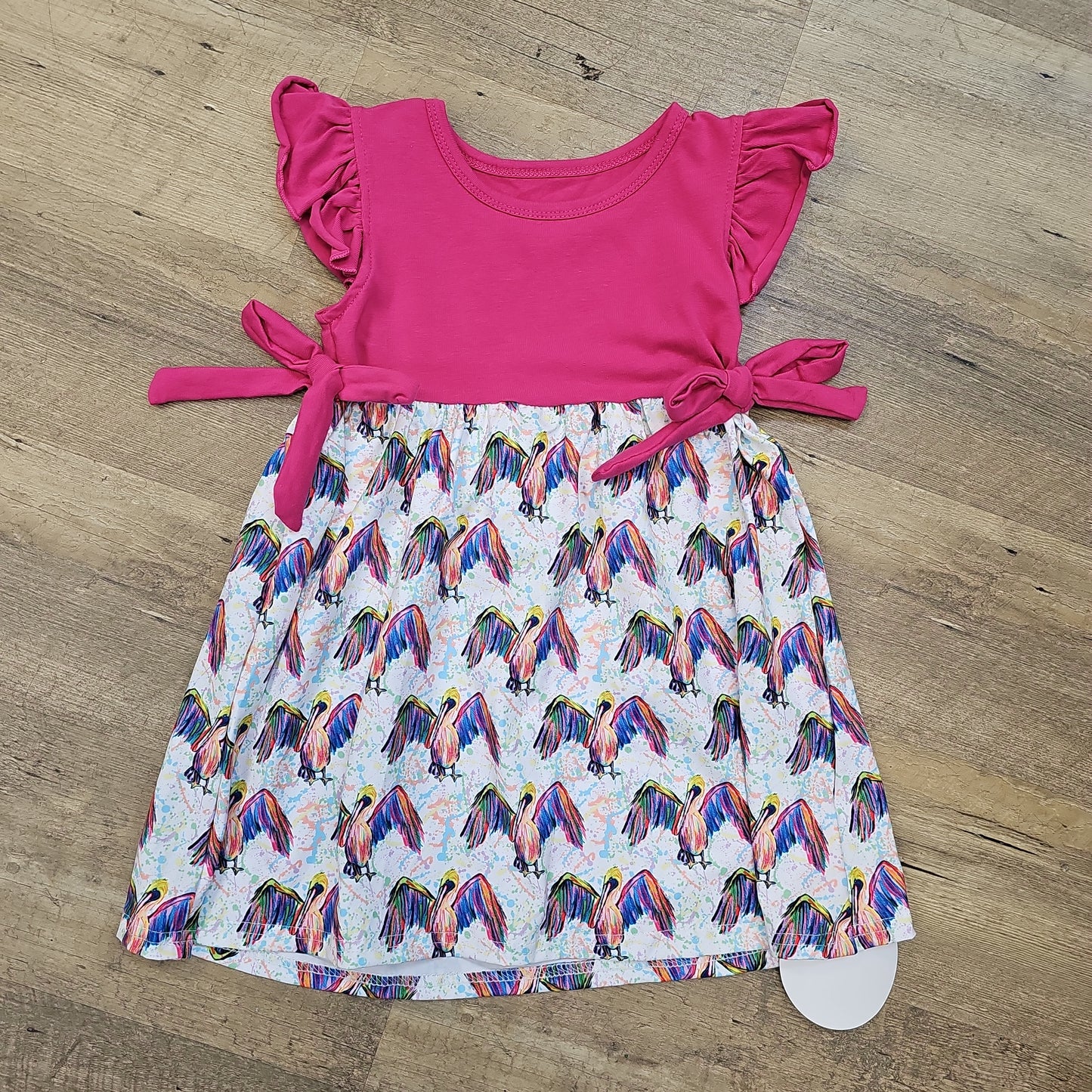 Bright Pelican Dress with Pink Ruffles