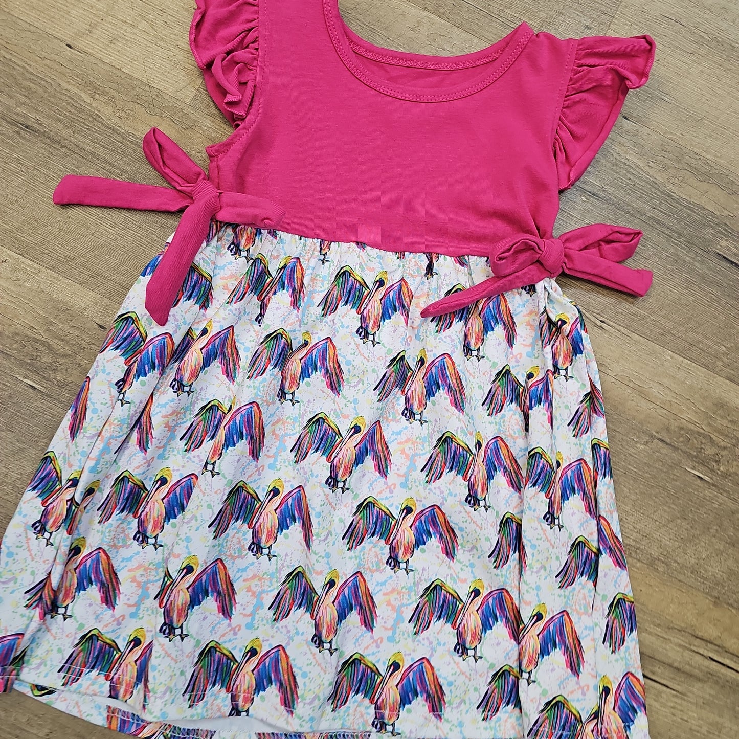 Bright Pelican Dress with Pink Ruffles