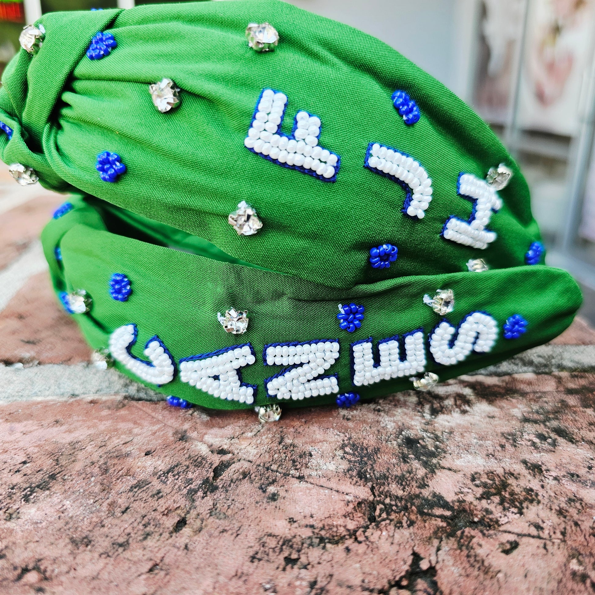 Fountain, blue junior high hurricanes, canes, green and blue headband Mandeville, Louisiana